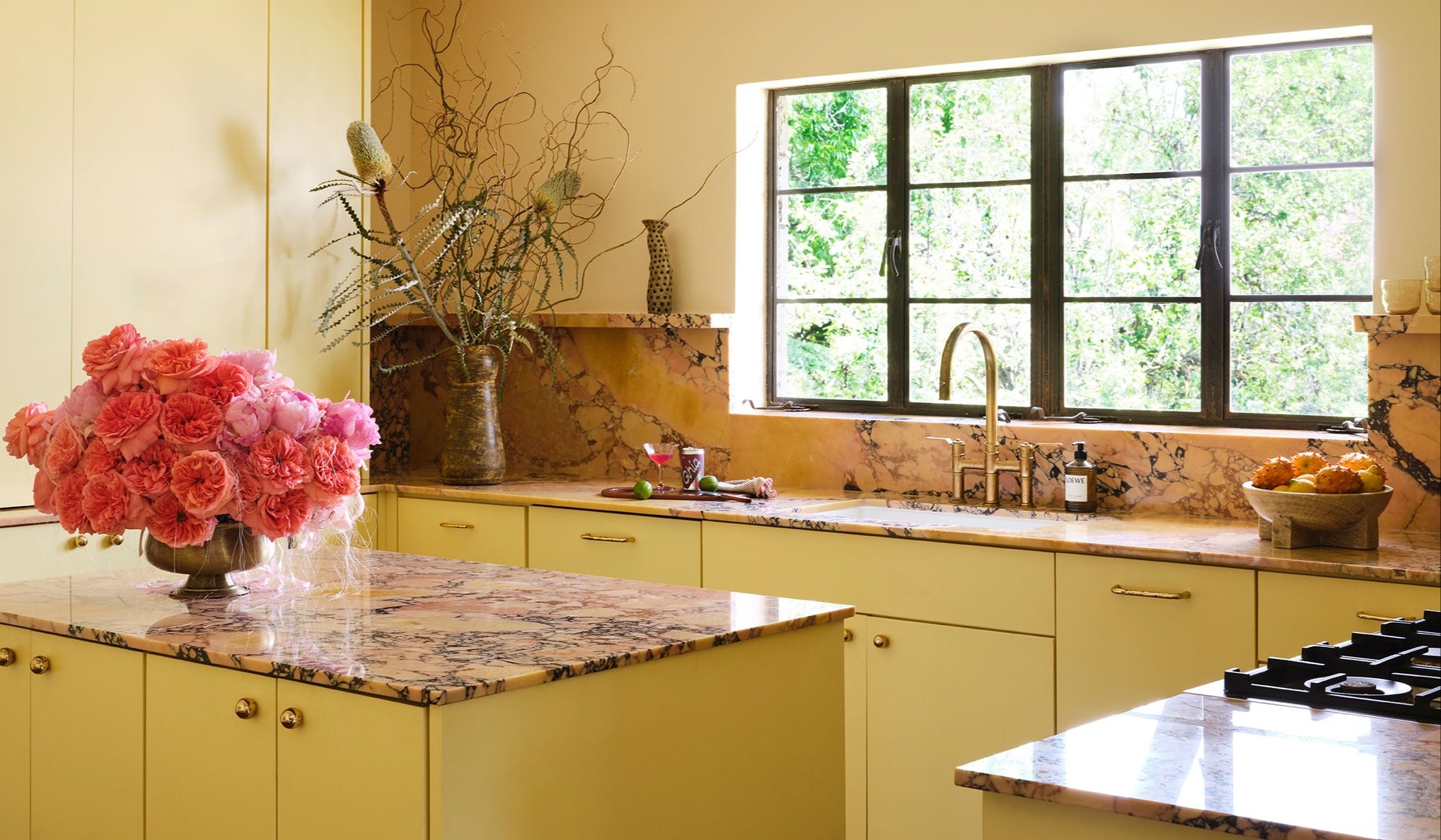 butter yellow kitchen with breccia scoppio marble slab
